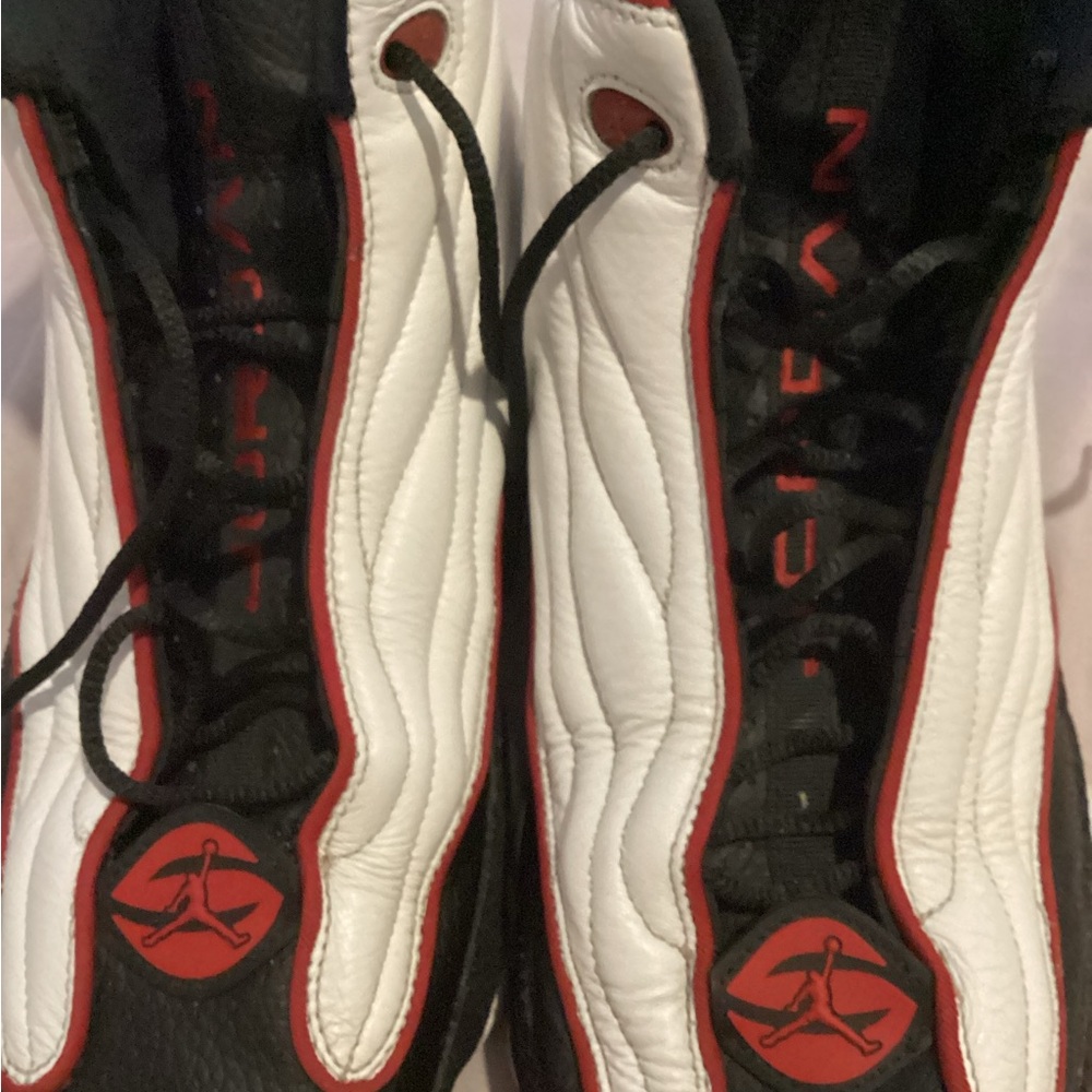 Jordan pro strong varsity red Stylish Black and White Sneakers with Red Accents